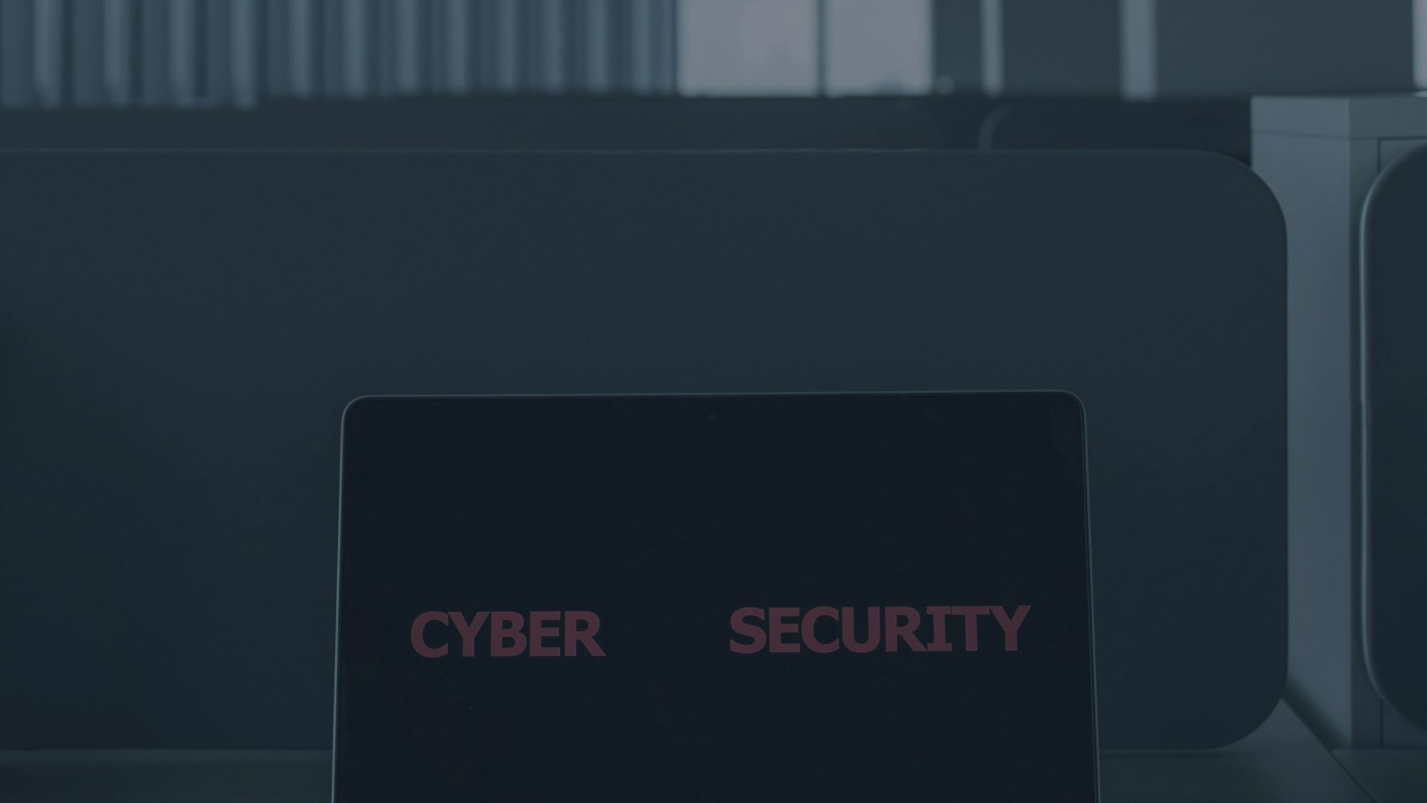 Laptop with cybersecurity alert for a hacked account and digital evidence